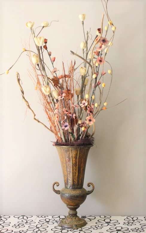 A beautiful large vintage decorative vase with lovely dried flowers.
