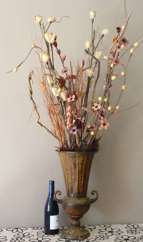 A beautiful large vintage decorative vase with lovely dried flowers.