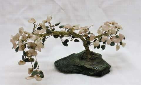 A stunning moonstone & adventurine gemstone and brass tree on a green quartz base.