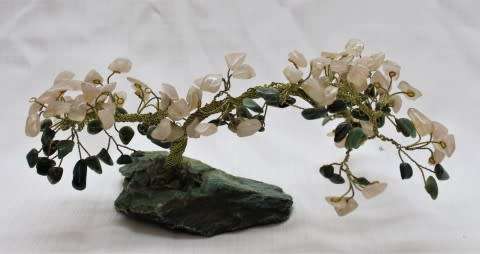 A stunning moonstone & adventurine gemstone and brass tree on a green quartz base.