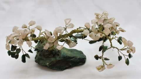 A stunning moonstone & adventurine gemstone and brass tree on a green quartz base.