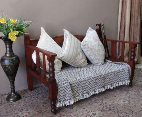 A wonderful well-made, sturdy vintage 2 seater Teak wood bench on castors, perfect  in a lapa/ patio