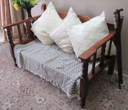 A wonderful well-made, sturdy vintage 2 seater Teak wood bench on castors, perfect  in a lapa/ patio