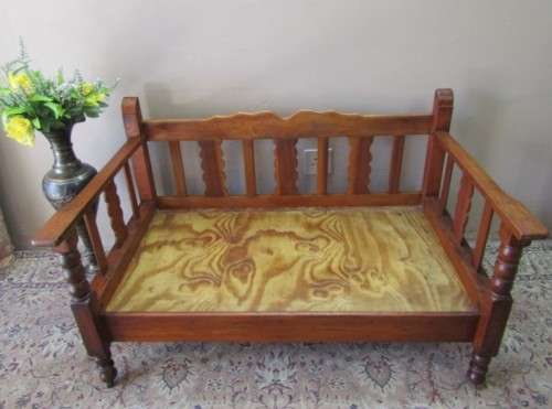 A wonderful well-made, sturdy vintage 2 seater Teak wood bench on castors, perfect  in a lapa/ patio