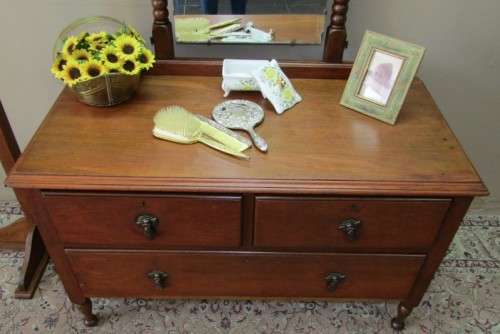 An amazing vintage Oak dressing table with a tilting bevelled centre mirror and three drawers.