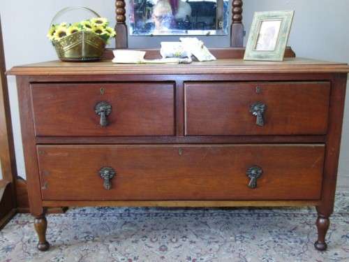 An amazing vintage Oak dressing table with a tilting bevelled centre mirror and three drawers.