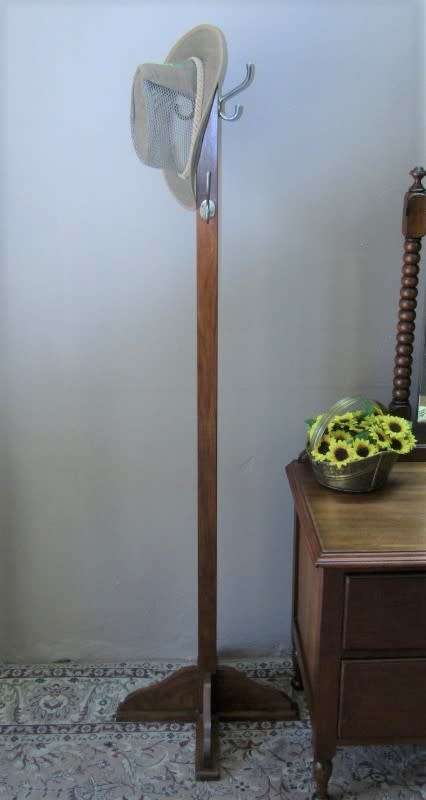 A stunning free standing Teak coat/ hat rack in good condition.Perfect in an entrance, hallway.