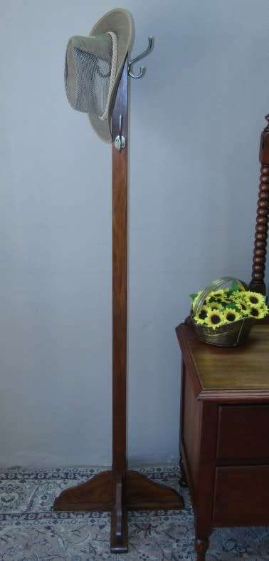 A stunning free standing Teak coat/ hat rack in good condition.Perfect in an entrance, hallway.