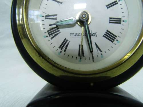 A gorgeous vintage mini Mercedes black metal wind up clock, working. Lifespace Sale