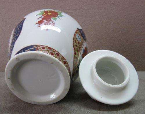 A beautiful, colorful Chinese lidded Ginger jar . Gorgeous on display!!