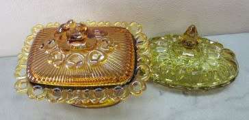Two lovely lidded coloured glass butter dishes, gorgeous on a breakfast table!