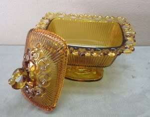 Two lovely lidded coloured glass butter dishes, gorgeous on a breakfast table!