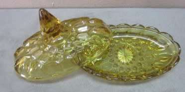 Two lovely lidded coloured glass butter dishes, gorgeous on a breakfast table!