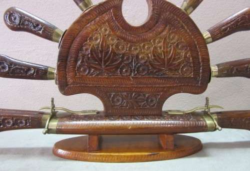 An awesome collectible hand carved Indian knife and fork carving set in a wood stand w/ brass trim