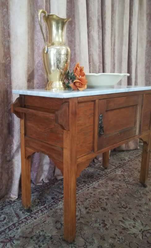 A wonderful vintage solid Oak single door wash stand with a white marble top on castors - stunning!!