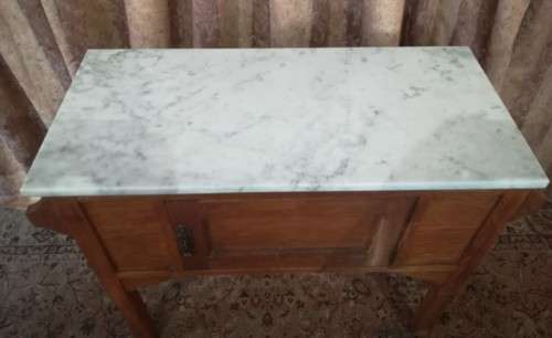 A wonderful vintage solid Oak single door wash stand with a white marble top on castors - stunning!!