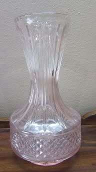 A stunning, eye catching pink glass vase!! Beautiful on display!! Lifespace Sale