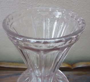 A stunning, eye catching pink glass vase!! Beautiful on display!! Lifespace Sale