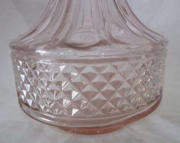 A stunning, eye catching pink glass vase!! Beautiful on display!! Lifespace Sale