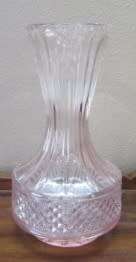 A stunning, eye catching pink glass vase!! Beautiful on display!! Lifespace Sale