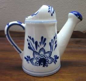 A wonderful small vintage porcelain watering can, great on display. Lifespace Sale