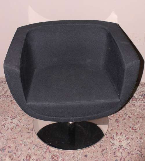 A stylish & modern pair of sleek, retro-styled black arm chairs, with thick durable fabric.