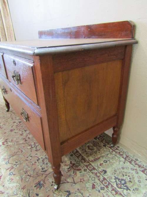 An amazing vintage Oak dressing table with three drawers and original castors. Stunning!!