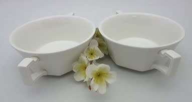 A lovely pair of white porcelain double handled soup bowls.  Lifespace Sale