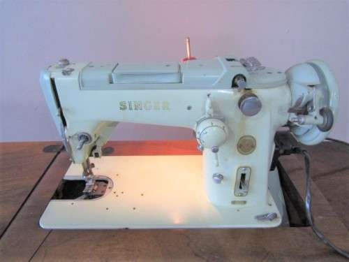 A remarkable vintage (1956-1961) Singer oak & cast iron stand with a 319K model sewing machine in