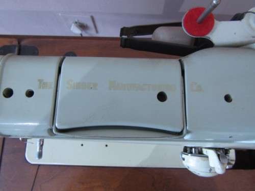 A remarkable vintage (1956-1961) Singer oak & cast iron stand with a 319K model sewing machine in