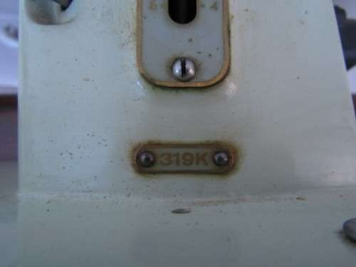 A remarkable vintage (1956-1961) Singer oak & cast iron stand with a 319K model sewing machine in