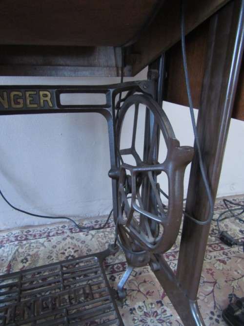 A remarkable vintage (1956-1961) Singer oak & cast iron stand with a 319K model sewing machine in