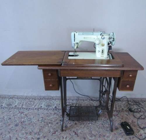 A remarkable vintage (1956-1961) Singer oak & cast iron stand with a 319K model sewing machine in