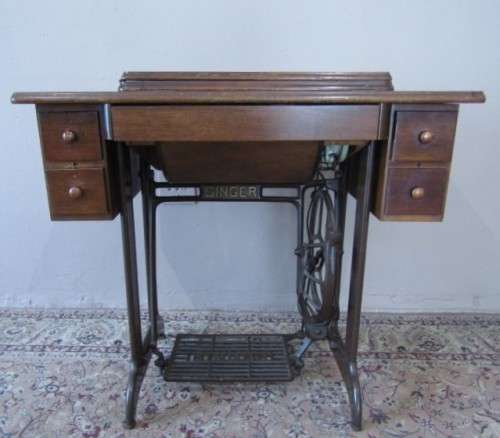 A remarkable vintage (1956-1961) Singer oak & cast iron stand with a 319K model sewing machine in