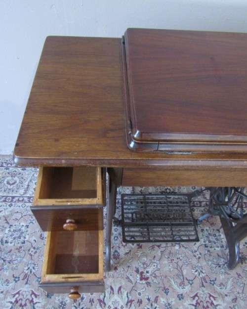 A remarkable vintage (1956-1961) Singer oak & cast iron stand with a 319K model sewing machine in