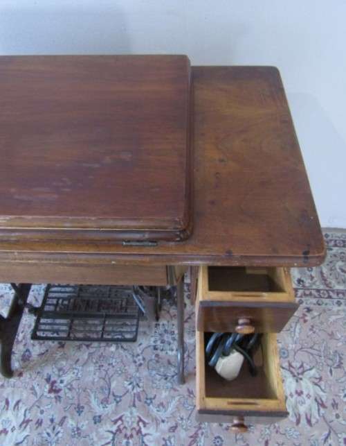 A remarkable vintage (1956-1961) Singer oak & cast iron stand with a 319K model sewing machine in