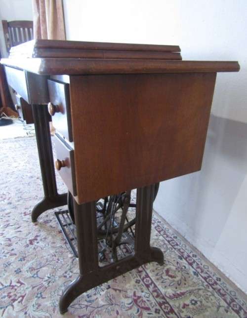 A remarkable vintage (1956-1961) Singer oak & cast iron stand with a 319K model sewing machine in