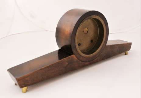 A beautiful wooden Mercedes mantel clock decorate with brass trimmings, working cold. Lifespace Sale