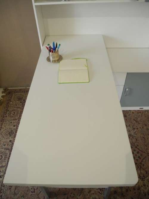 A stylish, modern `Mokki` book case with desk in white and blue.