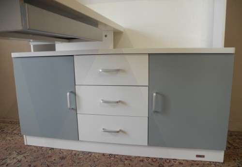 A stylish, modern `Mokki` book case with desk in white and blue.