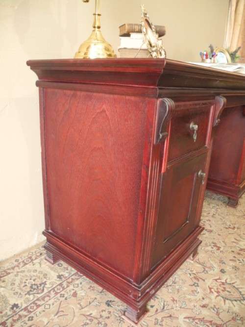 A gorgeous vintage Mahogany two-drawer, two cupboard library/ ladies writing desk w/ ornate handles
