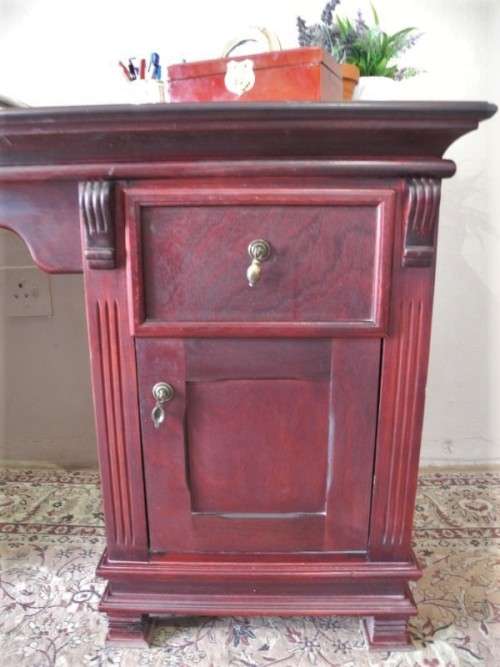A gorgeous vintage Mahogany two-drawer, two cupboard library/ ladies writing desk w/ ornate handles