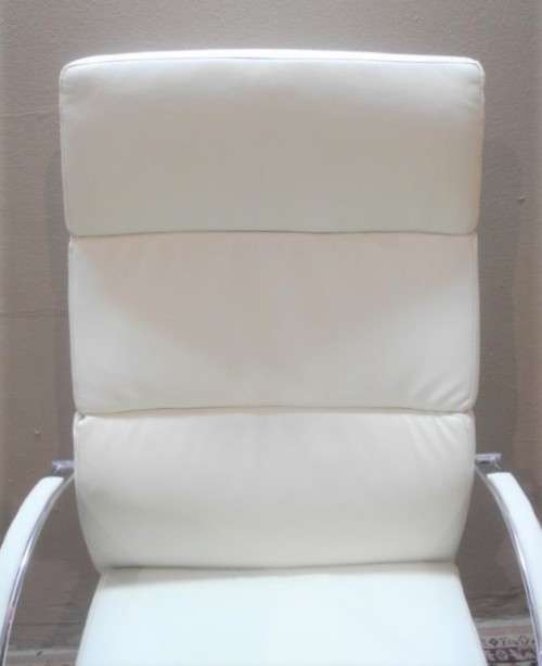 A lovely modern styled white faux leather office chair with height adjuster.