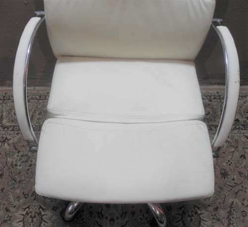 A lovely modern styled white faux leather office chair with height adjuster.