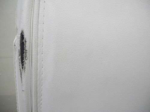 A lovely modern styled white faux leather office chair with height adjuster.