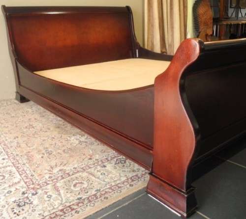 A stylish modern Coricraft Mahogany Queen sleigh bed with an Exotic pillow top mattress