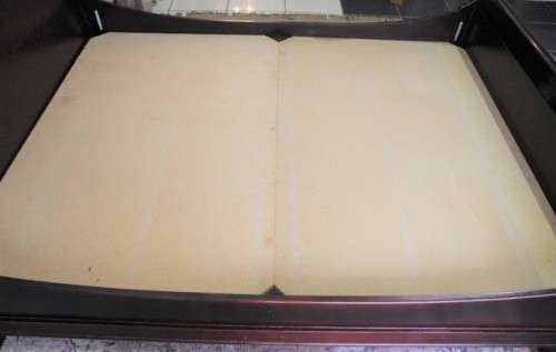 A stylish modern Coricraft Mahogany Queen sleigh bed with an Exotic pillow top mattress