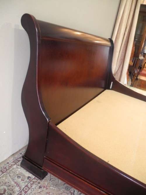 A stylish modern Coricraft Mahogany Queen sleigh bed with an Exotic pillow top mattress