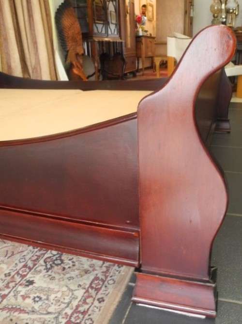 A stylish modern Coricraft Mahogany Queen sleigh bed with an Exotic pillow top mattress