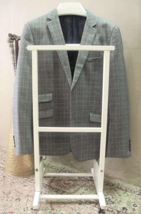 An awesome painted white wooden clothing stand "dumb valet" in good condition.